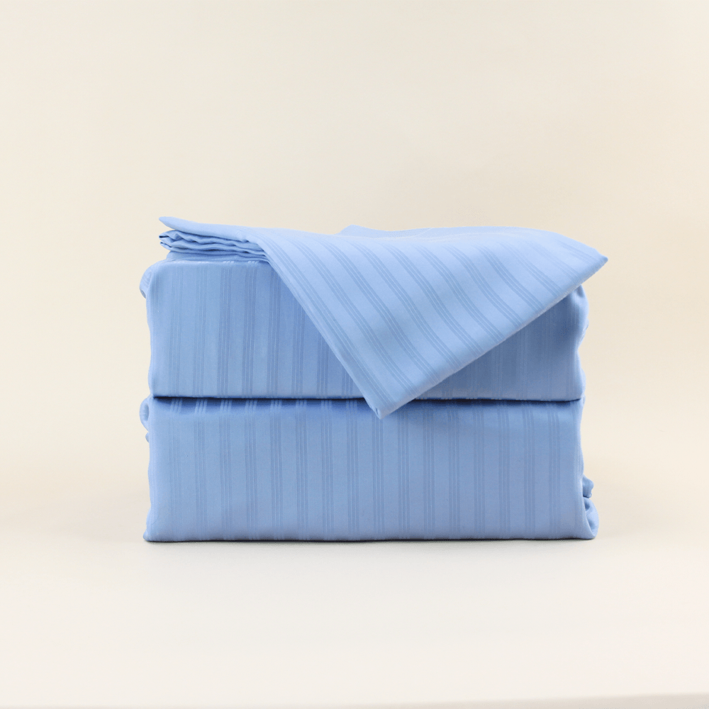 French blue stripe eucalyptus sheets folded and posing for the camera||French Blue Stripes